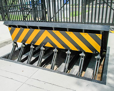 vehicle wedge barrier for restricted access area at stadium